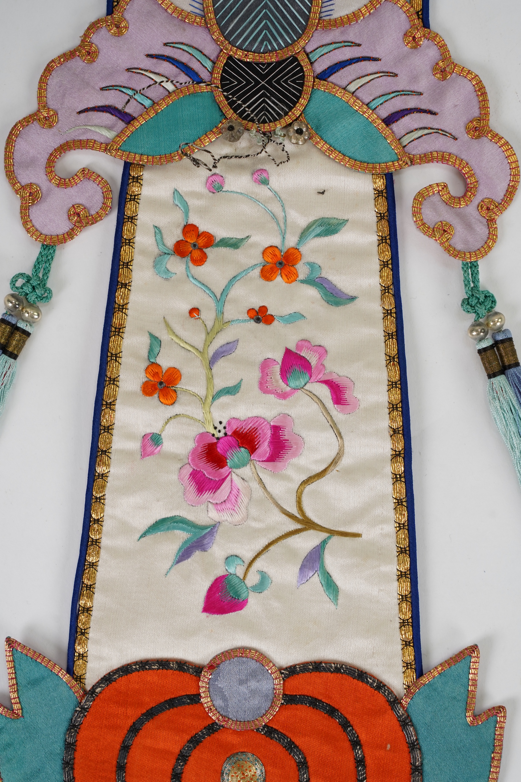 A pair of Chinese embroidered silk hanging pendants, early 20th century